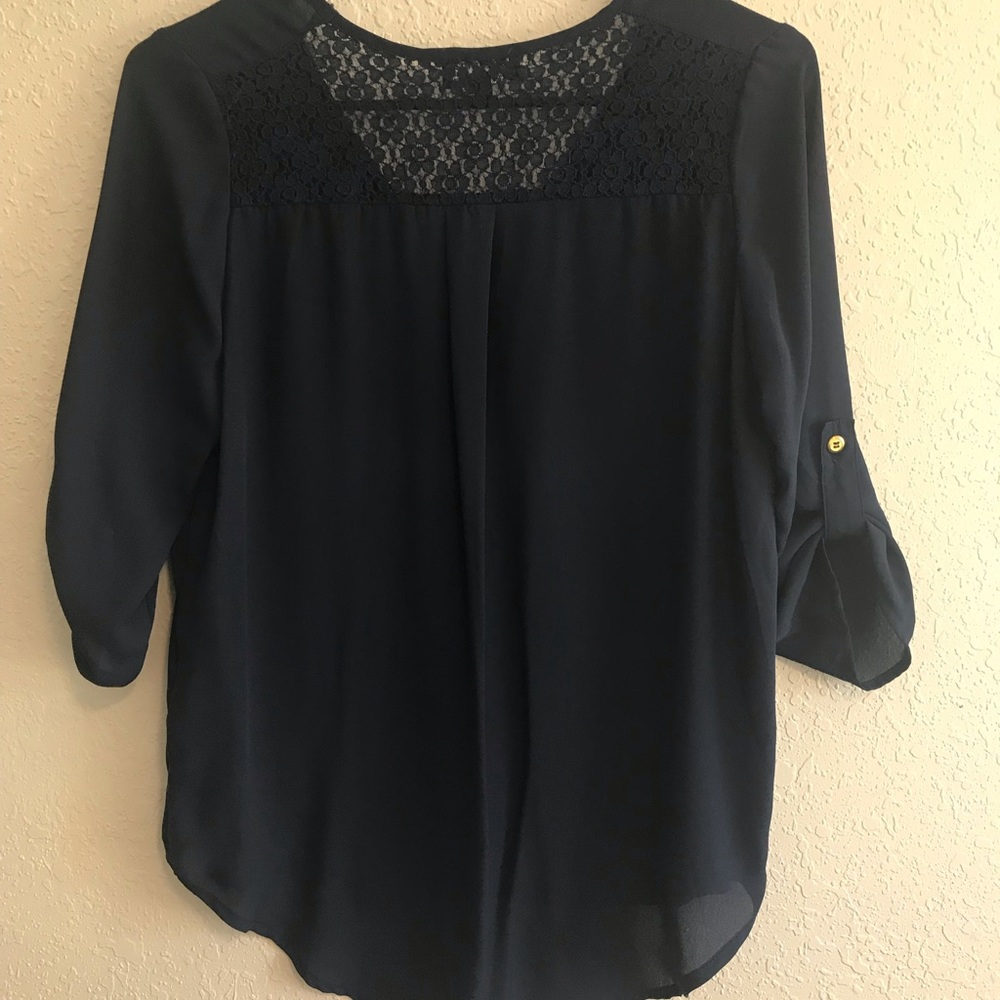 Flowing navy blouse with lace v neck